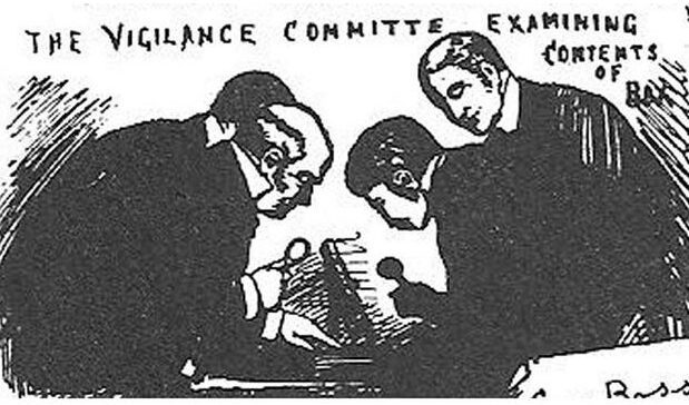 Three men closely examining papers, appearing serious and focused.