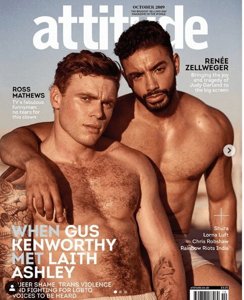 Two shirtless men pose closely on a magazine cover.