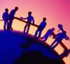 Silhouettes of people holding hands on a curved surface with a gradient background.