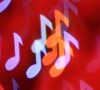 Colorful musical notes glowing against a red background.
