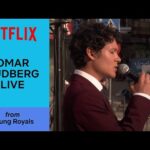 Singer performing live on Netflix stage.