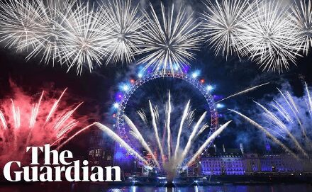 Spectacular fireworks light up the night sky over a city landmark.